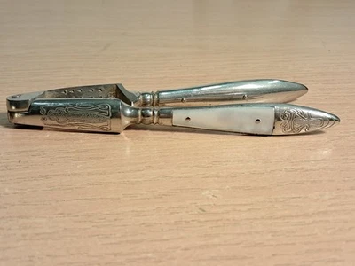 Pair Vintage Steel Nutcrackers with Mother Of Pearl Shell Handle Trims - Image 1 of 4