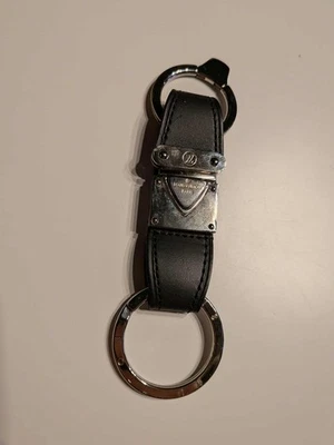 Porta-chaves Louis Vuitton Nomade Valet bolsa charme couro preto LV - Imagem 1 de 4