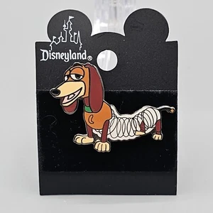 Prendedor de error de pintura de perro Slinky Toy Story Disney Pixar Parque Disneyland - Imagen 1 de 5