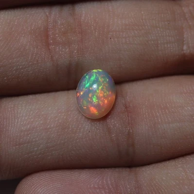1.4 Ct 9.8x7.7 MM Natural AAA Red Yellow Green Fire Ethiopian Opal Oval Cabochon - Image 1 of 4