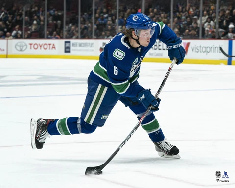 Brock Boeser Vancouver Canucks Unsigned Blue Jersey Shooting Photograph Cover
