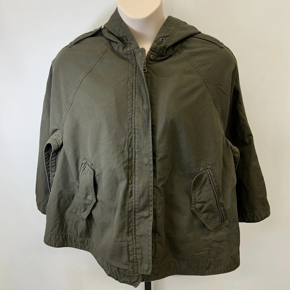 Poncho utilitário GAP com capuz tamanho XS/S verde oliva bolsos de algodão forro removível - Imagem 1 de 4