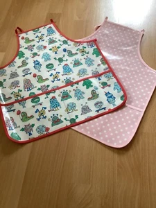 Ex Cath Kidston PVC oil cloth aprons - pink spot monsters - Picture 1 of 5