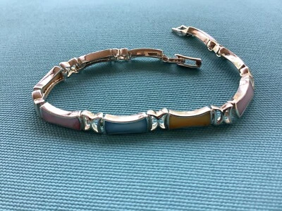 STERLING SILVER PINK,LT.BLUE & YELLOW MOTHER OF PEARL BRACELET W/BOW SHAPED BARS - Image 1 of 4