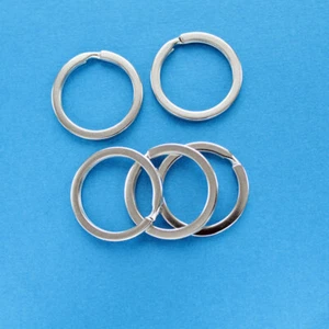 10 llaveros - anillos derramados - tono plateado 25 mm - Z068 - Imagen 1 de 2
