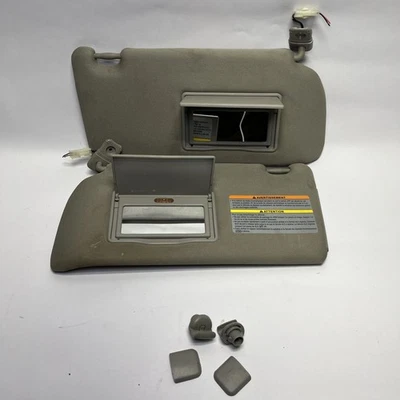 2005-2012 Nissan Pathfinder Left and Right Sun Visor Set gray w/ Lighted Mirror - Image 1 of 4