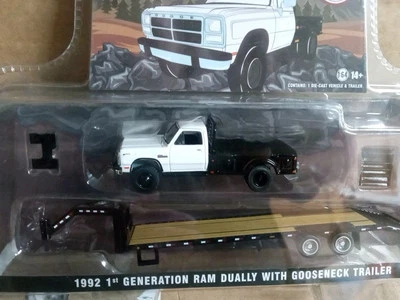 1:64 GREENLIGHT 1992 1ST GENERATION RAM DUALLY WITH GOOSENECK TRAILER White  - Image 1 of 2