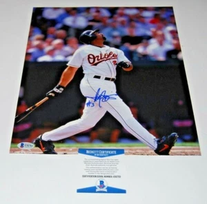 HAROLD BAINES signed (BALTIMORE ORIOLES) baseball 11X14 photo BECKETT BAS - Picture 1 of 1