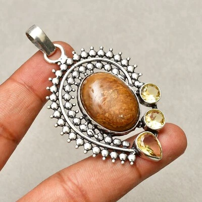 Colgante de joyería hecha a mano envuelto en alambre de cobre con piedras preciosas de bronceita 2,48" Foto 1 de 4