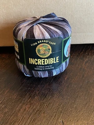 Four Skeins Lion BRAND Incredible Ribbon Yarn Color 204, Accent on Black - Image 1 of 3