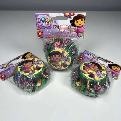 Wilton DORA The Explorer & BOOTS Backformen 3 x 50 ct 150 Tassen insgesamt - Bild 1 von 4