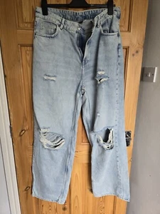 Pantalones de mezclilla rasgados de pierna ancha azules H&M para mujer talla 16 - Imagen 1 de 2