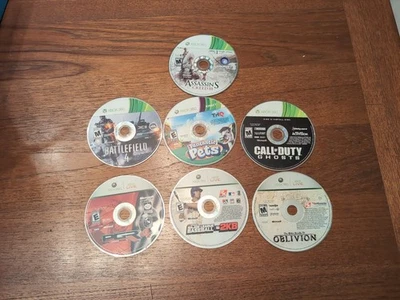 Lote de 7 discos de videojuegos Xbox 360 Cod Oblivion, Assassin's Creed, Bf4 Pgr4 Foto 1 de 4