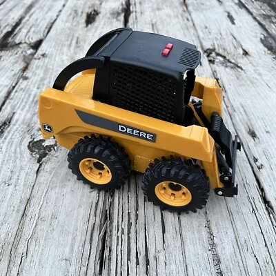 John Deere Ertl 320E Skid Steer Loader Lights & Sounds Toy Yellow - Image 1 of 4