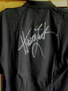 CAMISA POLO NEGRA CALLISTO HUDSON LEICK FIRMADA AUTOGRAFIADA LOGOTIPO XENA MED - Imagen 1 de 3