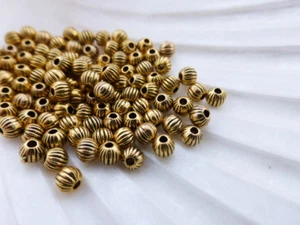 100 x 4mm Round Fluted Pumpkin Spacer Beads Antique Gold Colour LF       (MBX81) - Picture 1 of 1