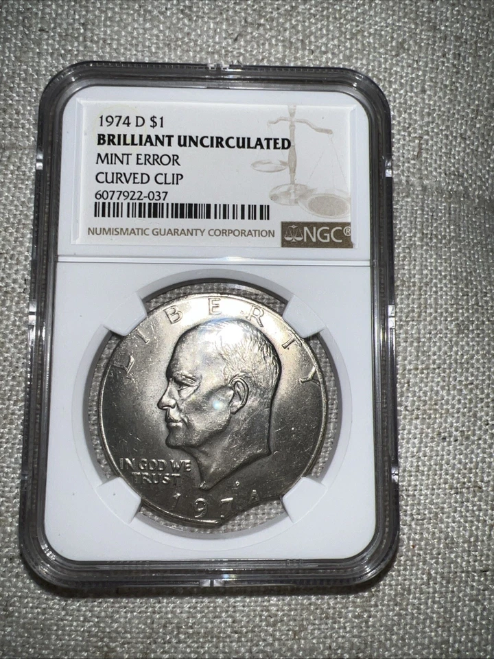 1974 D $1 Brilliant Uncirculated Mint Error Curved Clipped  - Image 1 of 2