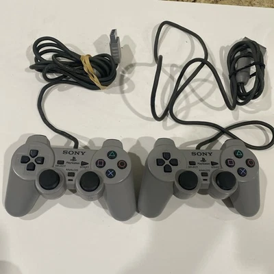 2 controladores Sony PlayStation 1 PS One Ps1 DualShock OEM color gris probado Foto 1 de 3
