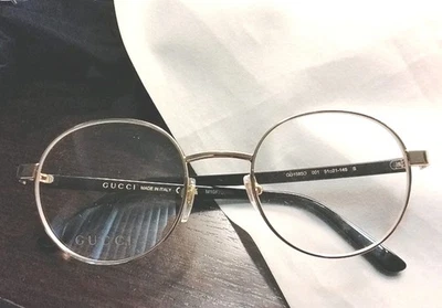 Marco de gafas dorado y negro GUCCI GG 1585O 001 51□21-145 Foto 1 de 4