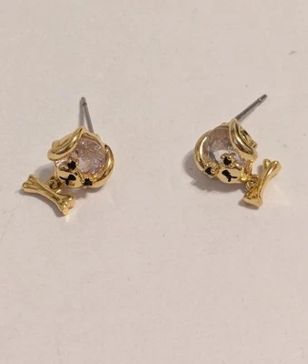 Pendientes colgantes cara/hueso de perro tono dorado con vidrio transparente facetado. 1/2" Foto 1 de 4