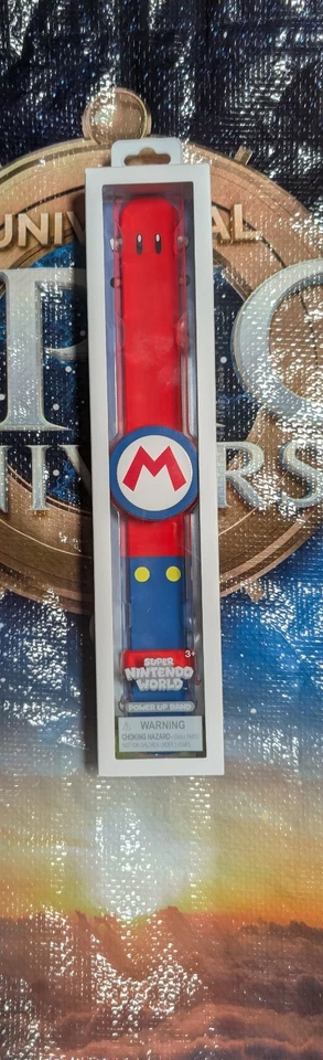 NUEVO Universal Studios Epic Universe Super Nintendo World Power Up Band - Mario Foto 1 de 1