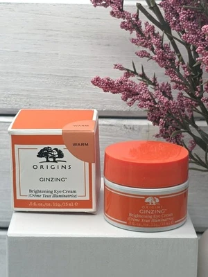 Crema iluminadora de ojos Origins GinZing, 0,5 fl oz, tono cálido Foto 1 de 4