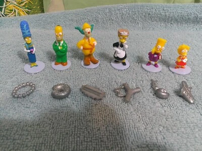 2006 Clue The Simpsons Edition Game Pieces Lot 6 Suspects Tokens & 6 Weapons - Image 1 of 4