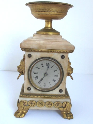Antique small French Marble Mantle Clock With Gilt Bronze Urn and Lion Handles Cover