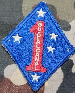 Parche de Marina de los Estados Unidos Segunda Guerra Mundial 1ª División Guadalcanal Raza Antigua PUC 2 Estrellas Segunda Guerra Mundial - Imagen 1 de 2