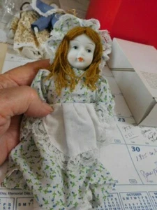 8" ornament doll with red string hair and bisque face, hands and feet - Picture 1 of 4