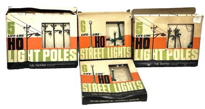 4 CAJAS (16) DE POSTES DE LUZ DE CALLE ELÉCTRICOS HO SLOT CAR CARRERAS REALISTAS EE. UU. Foto 1 de 4