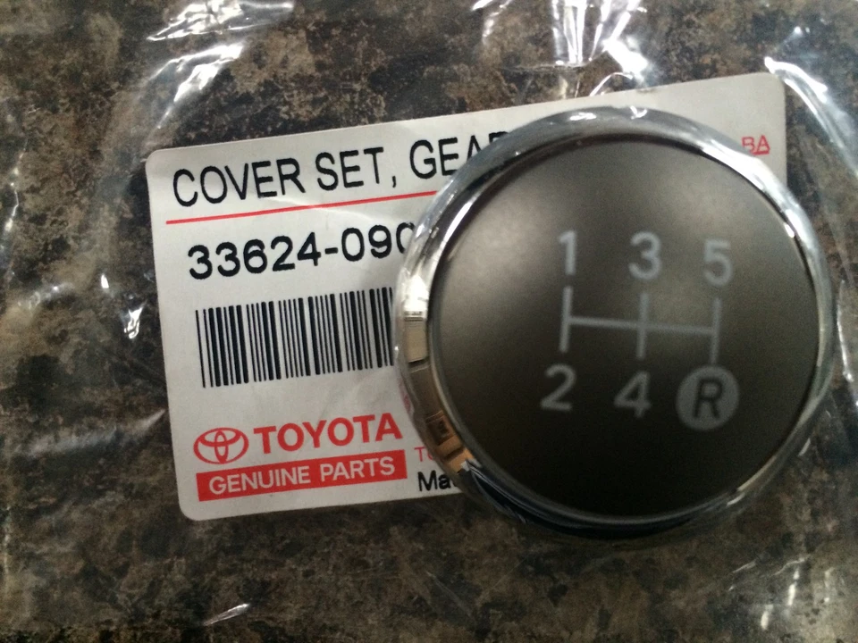 BOTÃO DE ENGRENAGEM GENUÍNO TOYOTA YARIS 2010 TAMPA CROMADA TOP APENAS 5 VELOCIDADES 2010 - Imagem 1 de 1