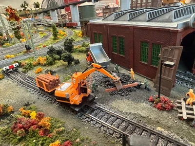 Ho scale Cat Railroad Tie Loader with loaded cart in Orange unpainted - Image 1 of 4