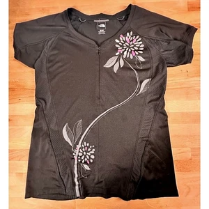 Top de ciclismo de malla de manga corta The North Face negro floral 1/4 cremallera para mujer talla M - Imagen 1 de 7