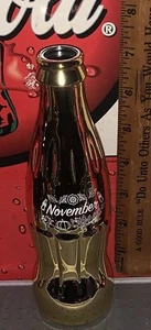 COCA - COLA BIRTHSTONE MONTH NOVEMBER 8OZ AIR FILLED GOLD CHROME COKE BOTTLE - Picture 1 of 2