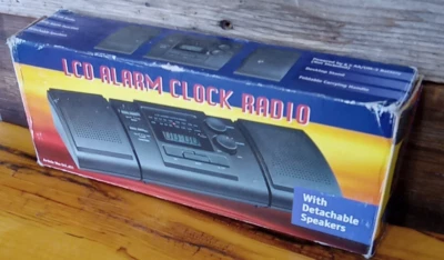 LCD ALARM CLOCK RADIO WITH DETACHABLE SPEAKERS BLACK 10.5” LONG X 4” WIDE  - Image 1 of 4