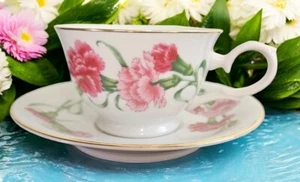 Taza de té y platillo de porcelana AVON flores del mes como nuevo clavel ENERO - Imagen 1 de 6