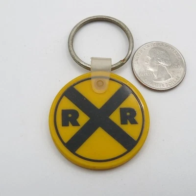 Llavero redondo de plástico amarillo Burlington Northern Railroad Foto 1 de 2