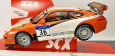 Игрушечные модели автомобилей для гоночных трасс торговой марки SCX Porsche
