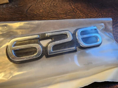 Nuevo Mazda 626 Insignia emblema maletero nuevo (GA2K-51-720) 1993 a 1997 Foto 1 de 3