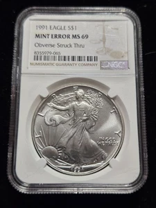 1991 Silver Eagle NGC MS69 MINT ERROR Obverse Struck Thru (Z-1132) - Picture 1 of 3