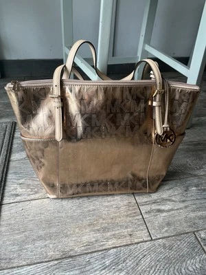 Michael Kors metallic rose gold purse  - Image 1 of 4