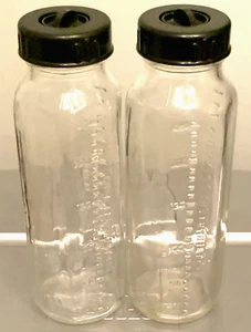2 Vintage 50s/60s Evenflo 8oz Glass Nurser Baby Bottles w Black Lids & Disc Caps - Picture 1 of 8