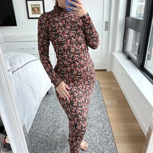 Ramy Brook figurbetontes Midikleid Rollkragen Blumenmuster braun Small - Bild 1 von 10