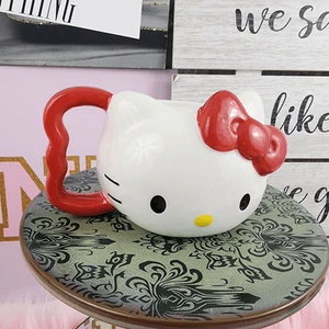 Neu mit Etikett Hello Kitty Gesicht rot & weiß Keramiktasse - Bild 1 von 5