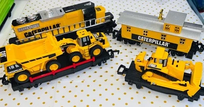 4 pc 1992 Caterpillar Train Set With Construction Vehicles and Caboose - Image 1 of 4
