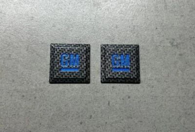 Genuine GM Mark Carbon Fiber & Blue Emblem Pair x2 Side Door OEM Tahoe Escalade - Image 1 of 2