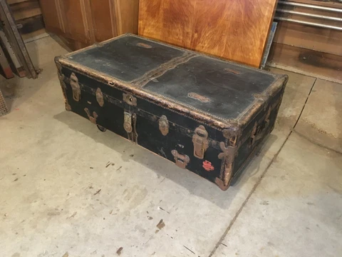 antique steamer trunk with Paris Louvre Grand Hotel sticker Cover