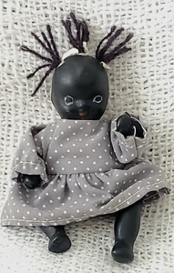 VINTAGE 1950s-60s BLACK BISQUE BABY DOLL IN COUNTRY-STYLE DRESS - 4" - Picture 1 of 8