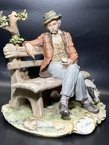 CAPODIMONTE "Il Solitario" Porcelain Figurine on Bench by Sandro Maggioni - Picture 1 of 8